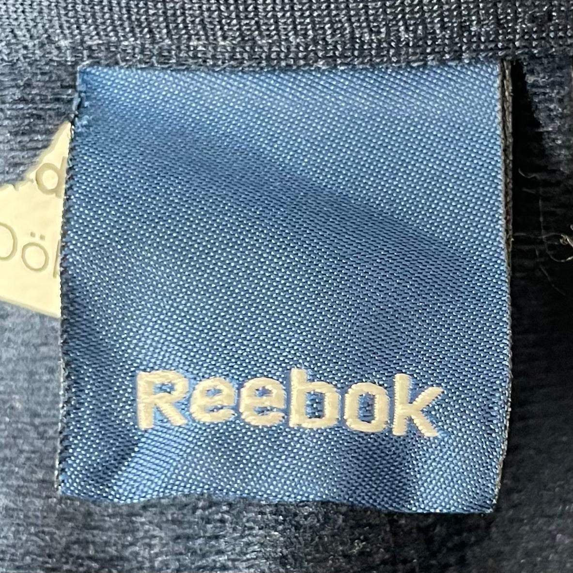 00s vintage 古着　ビンテージ　リーボック　Reebok　トラックジャケット　ロゴ刺繍　ダメージ加工　ストリート　オーバーサイズ